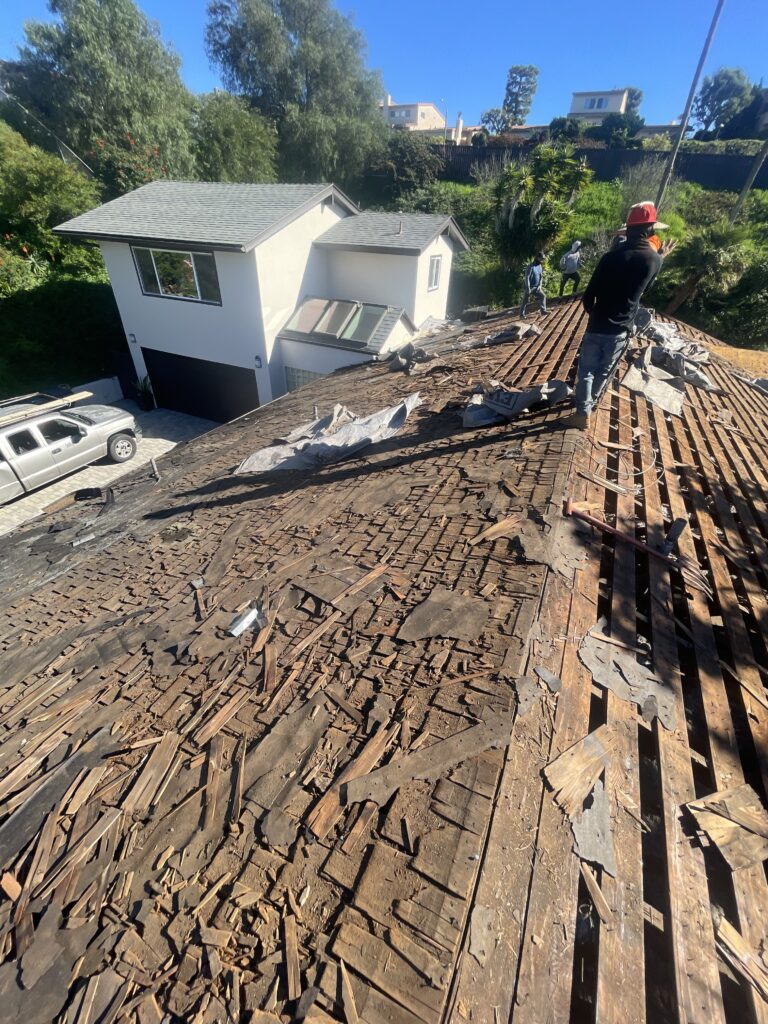 Project Overview This residential roofing project presented several challenges due to multiple previous roof repairs and the presence of several layers of aging shingles installed over the original wood shake roofing system. Over time, these layered roofing materials can conceal underlying issues, add excessive weight to the structure, and reduce the overall effectiveness of the roofing system. After a thorough inspection, Golem Roofing recommended a complete roof replacement to ensure long-term performance, structural integrity, and reliable weather protection. Project Challenges The existing roof had undergone numerous repairs throughout its lifespan, resulting in: Multiple layers of old asphalt shingles Original wood shake roofing beneath the shingle layers Increased roof weight from accumulated roofing materials Potential ventilation and performance concerns Reduced lifespan of previous roofing systems Hidden substrate conditions that could only be evaluated after removal Our Solution To provide the homeowner with a durable, long-lasting roofing system, Golem Roofing performed a complete tear-off and replacement. Scope of Work Complete removal of all existing roofing materials Tear-off down to the roof deck Inspection of the exposed roof substrate Installation of new radiant barrier roof sheathing Installation of a complete GAF roofing system Application of GAF Timberline HDZ architectural shingles Final inspection and quality assurance review Upgraded Roofing System New Radiant Barrier Sheathing Once the existing roofing materials were removed, new radiant barrier sheathing was installed to improve the roof's overall performance. Benefits include: Improved energy efficiency Reduced attic heat buildup Enhanced indoor comfort Better long-term roof system performance Increased protection for the home structure GAF Timberline HDZ Roofing System The homeowner selected the industry-leading GAF Timberline HDZ roofing system, known for its durability, wind resistance, and attractive architectural appearance. Key advantages include: Exceptional weather protection Advanced LayerLock™ technology High wind resistance Long-lasting performance Enhanced curb appeal Industry-leading manufacturer support Warranty Protection One of the most valuable aspects of this project is the comprehensive warranty coverage provided to the homeowner. Manufacturer Warranty 50-Year GAF Manufacturer System Warranty Coverage for roofing materials and system performance Protection backed by one of North America's leading roofing manufacturers Golem Roofing Workmanship Warranty 12-Year No-Leak Workmanship Warranty Coverage for installation-related issues Added confidence in the quality of workmanship Third-Party Protection $250,000 Third-Party Guarantee Additional layer of protection beyond standard warranty coverage Increased long-term peace of mind for the homeowner Project Results The completed roof replacement transformed an aging, heavily layered roofing system into a modern, high-performance roofing solution designed for decades of reliable protection. Results at a Glance ✅ Complete tear-off down to the roof deck ✅ Removal of multiple roofing layers and original wood shakes ✅ New radiant barrier sheathing installed ✅ GAF Timberline HDZ architectural shingles ✅ 50-Year GAF Manufacturer System Warranty ✅ 12-Year No-Leak Workmanship Warranty ✅ $250,000 Third-Party Guarantee ✅ Improved energy efficiency and roof performance ✅ Enhanced curb appeal and property value Conclusion Complete Roof Replacement with GAF Timberline HDZ Roofing System The homeowner now has a durable, energy-efficient roofing system designed to provide reliable protection and peace of mind for decades to come. Contractor: Golem Roofing Service: Complete Roof Replacement Roofing System: GAF Timberline HDZ Warranty: 50-Year GAF System Warranty + 12-Year No-Leak Workmanship Warranty
